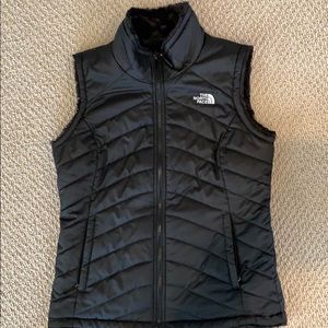 Woman’s black reversible Northface vest